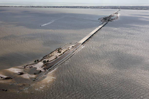 SANIBEL, FLORIDA - SEPTEMBER 29: In this aerial view, parts of Sanibel Causeway are washed away along with sections of the bridge as Hurricane Ian passed through the area on September 29, 2022 in Sanibel, Florida. The hurricane brought high winds, storm surge and rain to the area causing severe damage. (Photo by Joe Raedle/Getty Images)